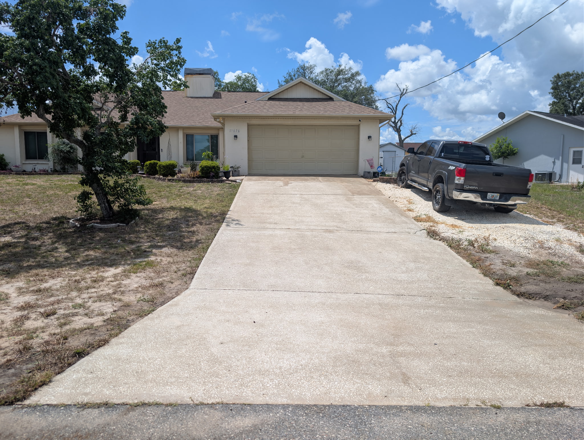 Same home driveway after cleaning — fresh and bright